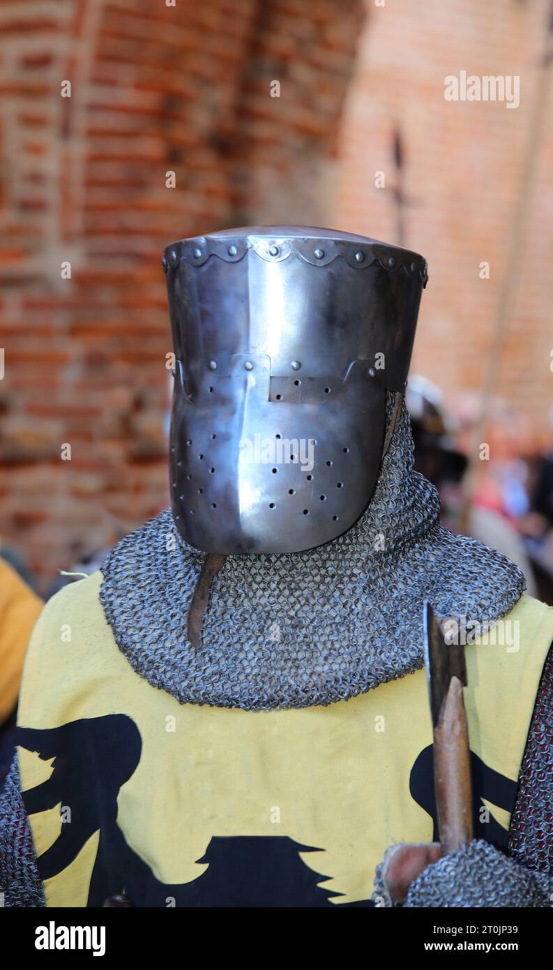 medieval knight with armor and protective metal helmet on his head