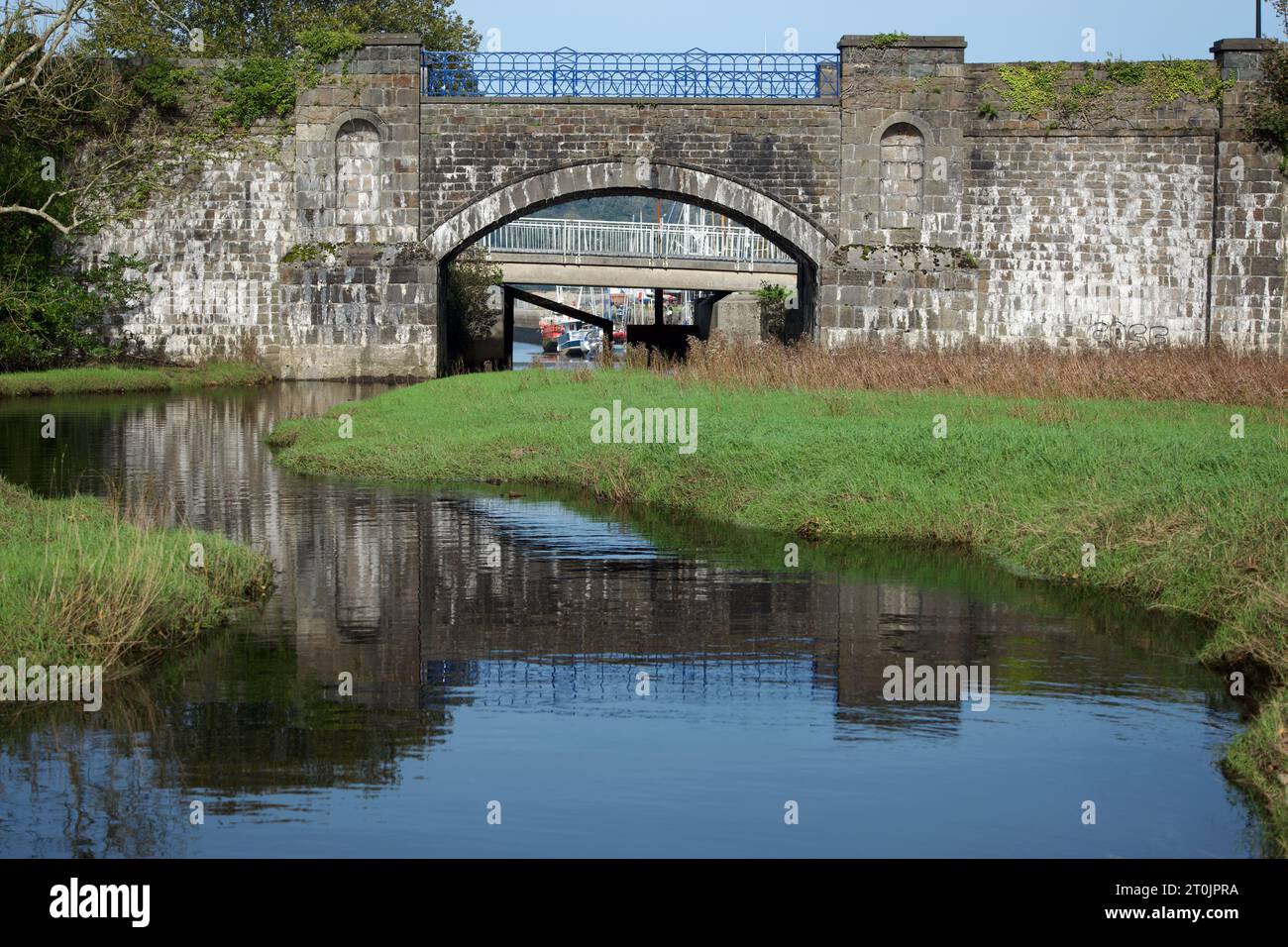 Porth Penrhyn Bridge is in Bangor or Penrhyn Docks (Porth Penrhyn) in North Wales. It spans the River Cegin and was built in 1820. Stock Photo