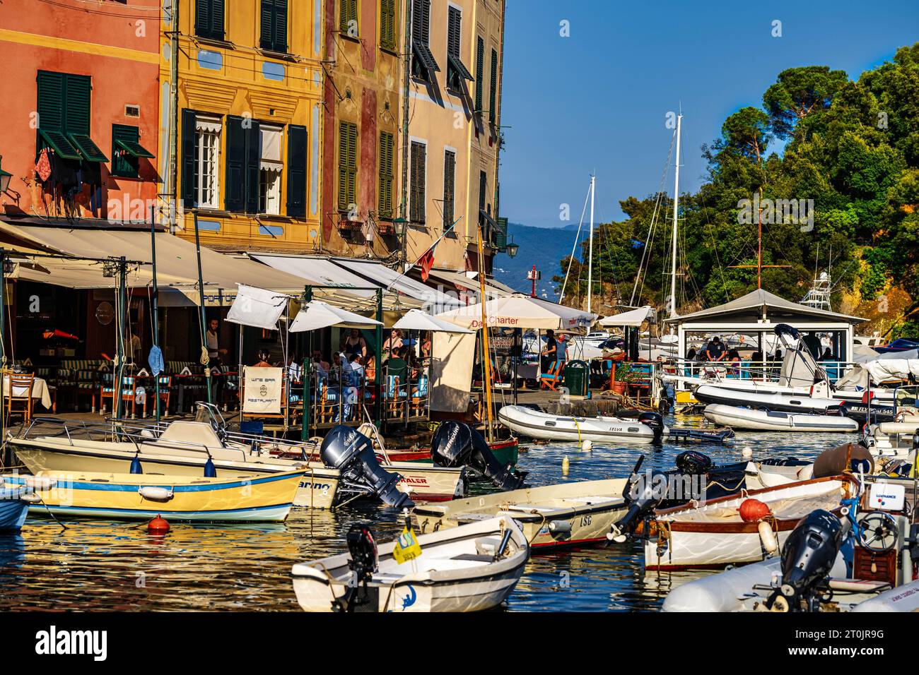 Fishing boats moored in Portofino Italy in the summer with outdoor