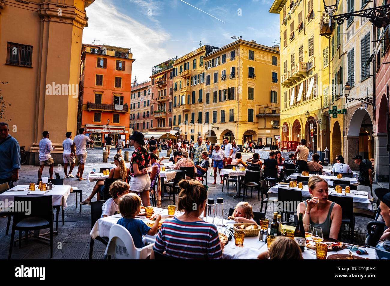 A  Mediterranean meal in Italy, outdoor dining in Europe, the historic village Santa Margherita on a warm Summer evening with food and drinks Stock Photo