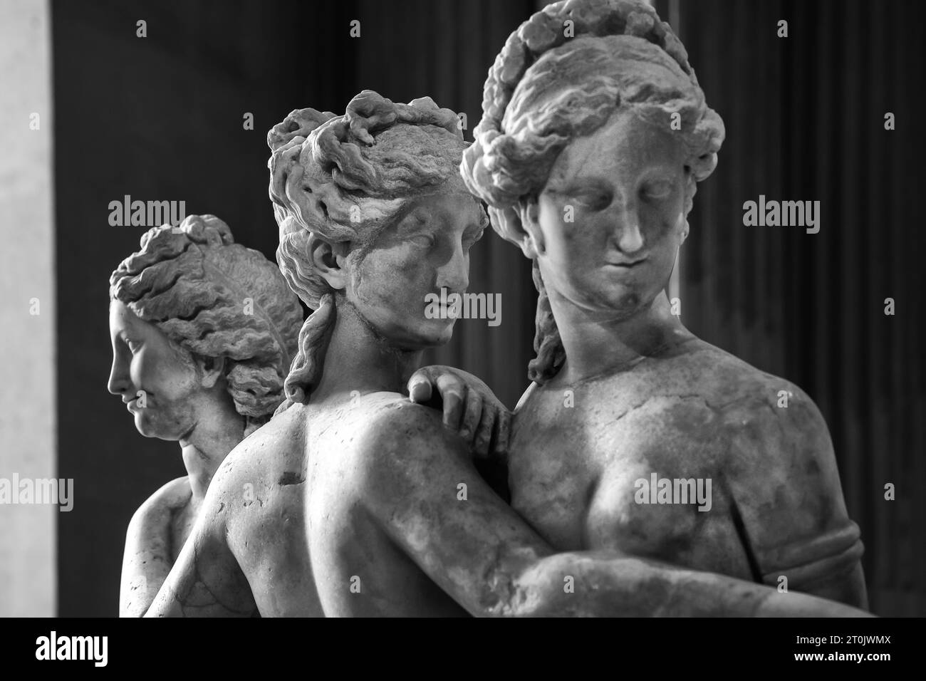 The Three Charites (Graces) each resting a hand on the shoulder of another, at Louvre Museum, Paris. Stock Photo