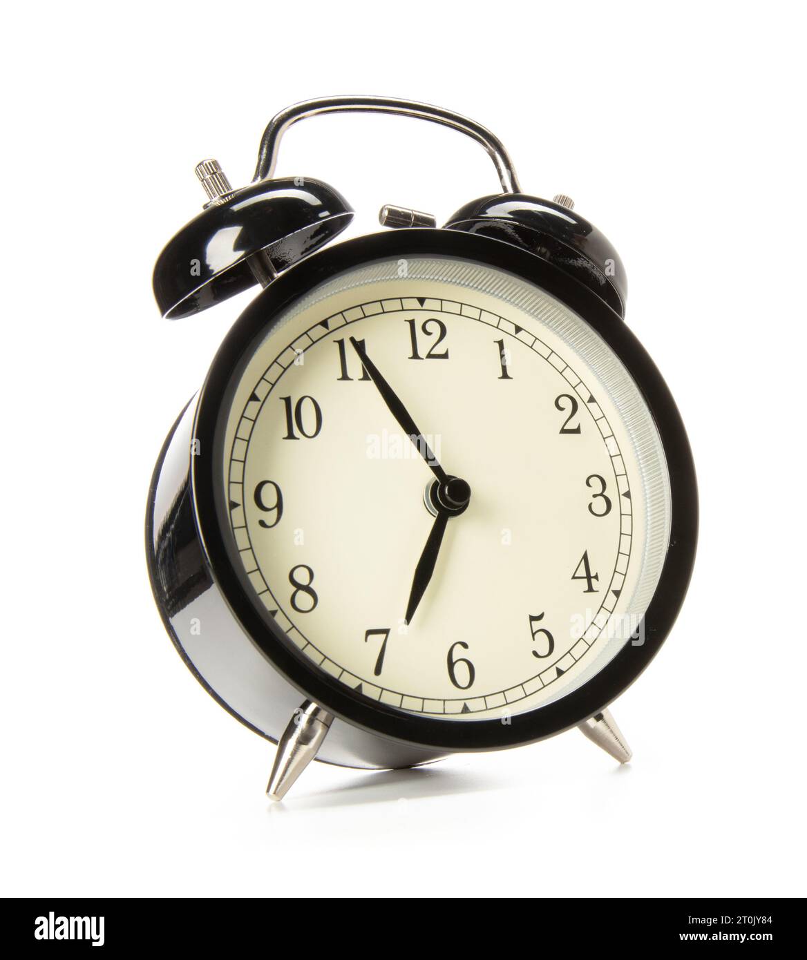 Old-fashioned alarm clock on white background Stock Photo - Alamy