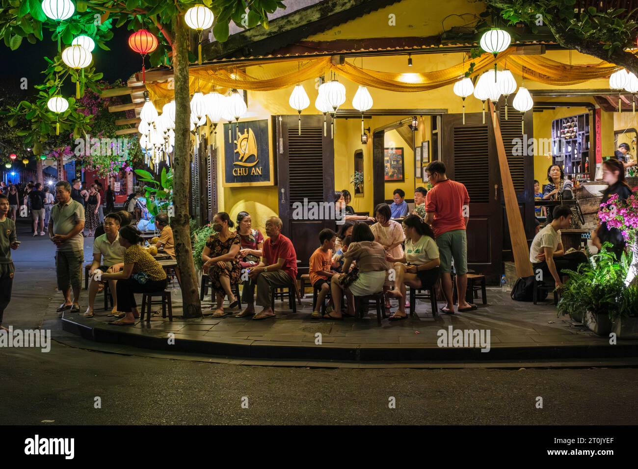 Hoi An, Vietnam. Customers at an Outdoor Cafe at Night. Stock Photo