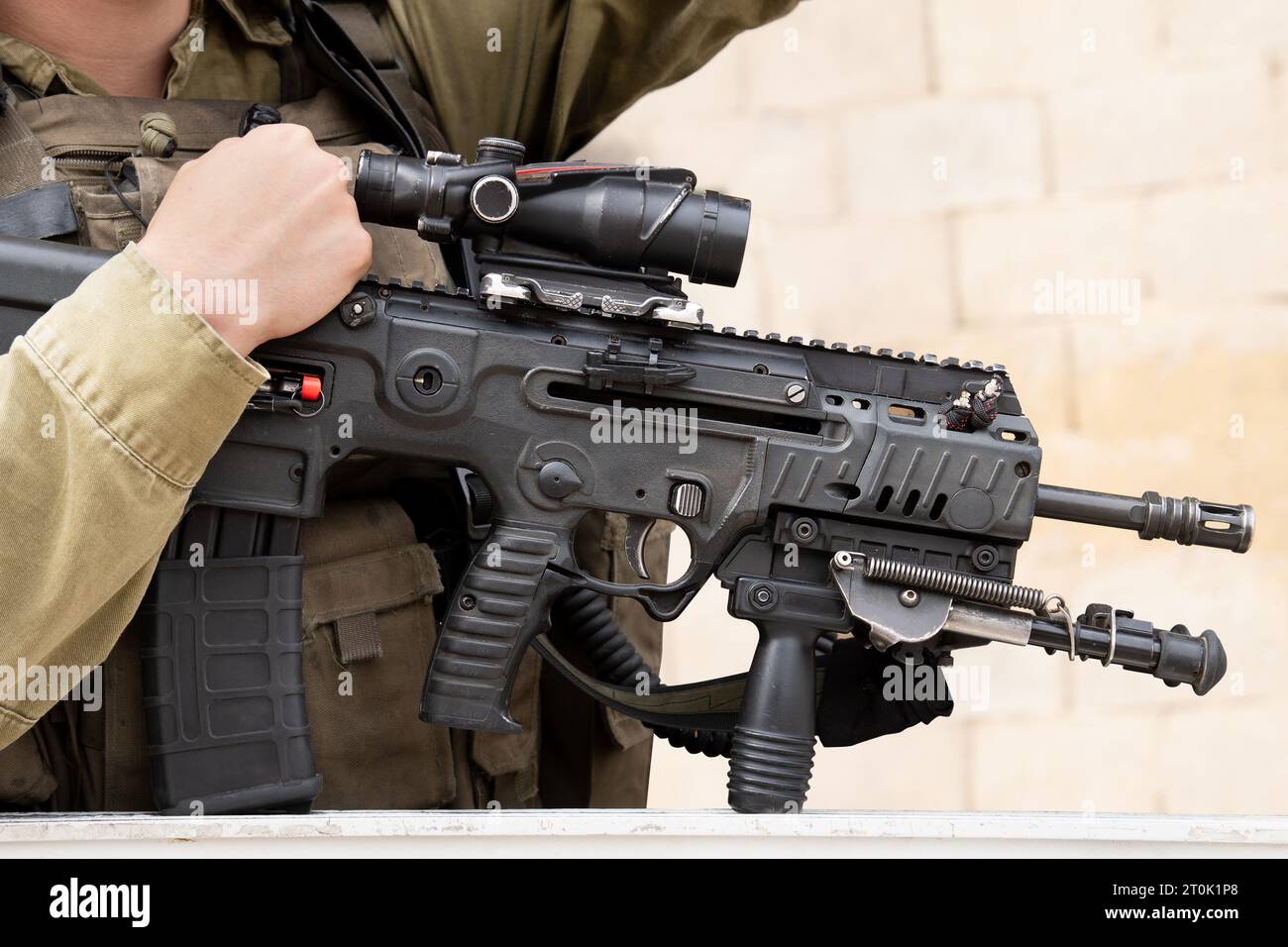 Israeli assault rifle or machine gun in Israeli soldier's hands close