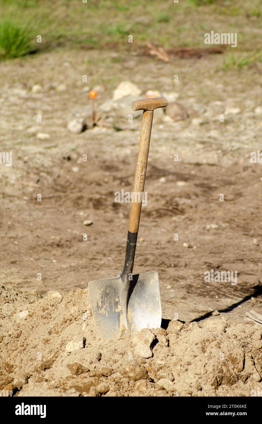 shovel stuck in a pile of earth in an archaeological excavation Stock Photo