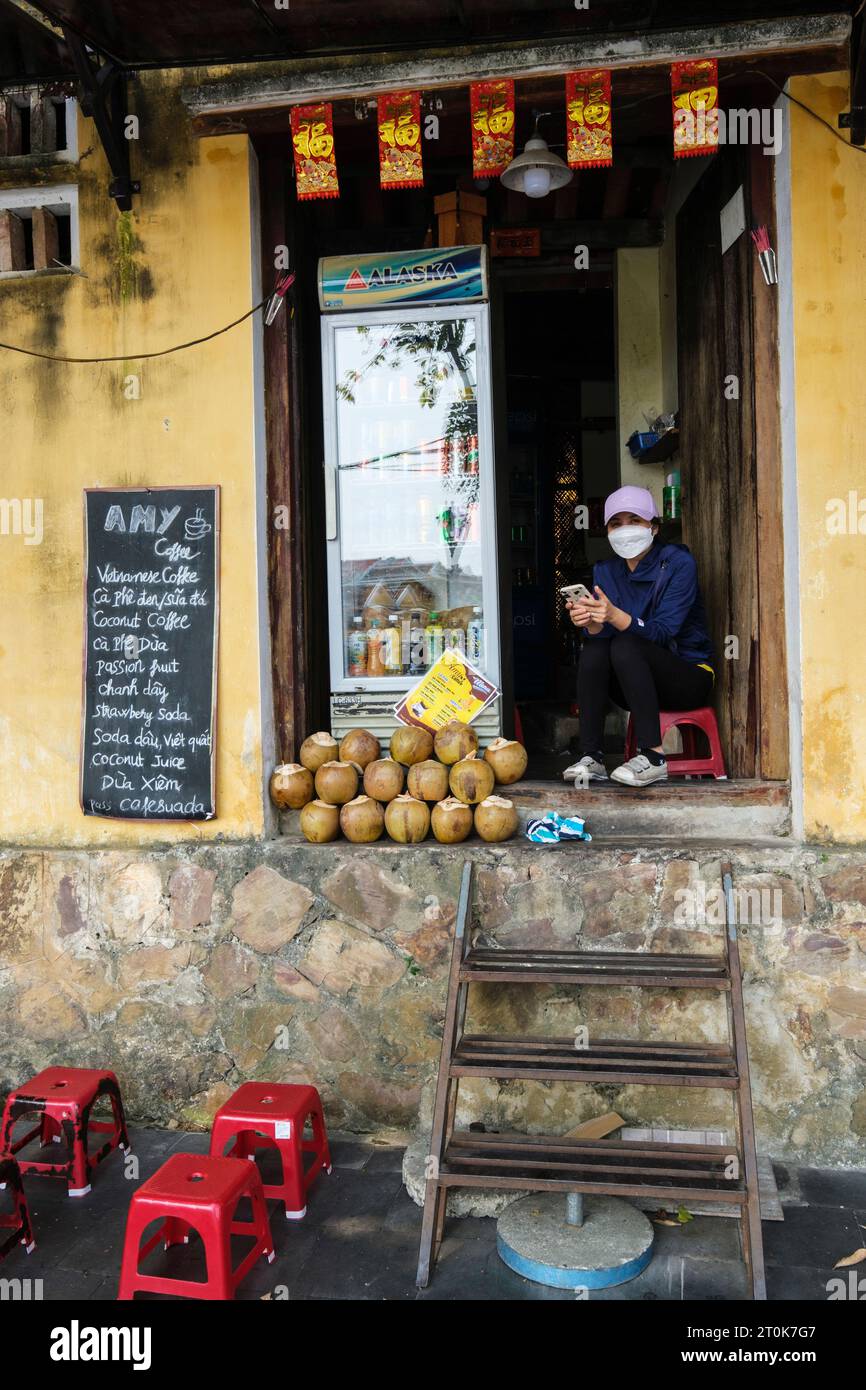 Hoi An, Vietnam. Woman Selling Coconuts and Refreshments. Stock Photo