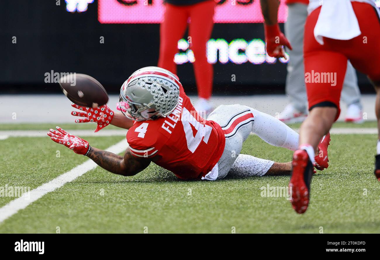 Columbus, United States. 07th Oct, 2023. Ohio State Buckeyes Julian Fleming (4) makes a sliding catch during the second half against the Maryland Terrapins in Columbus, Ohio on Saturday, October 7, 2023. Photo by Aaron Josefczyk/UPI Credit: UPI/Alamy Live News Stock Photo