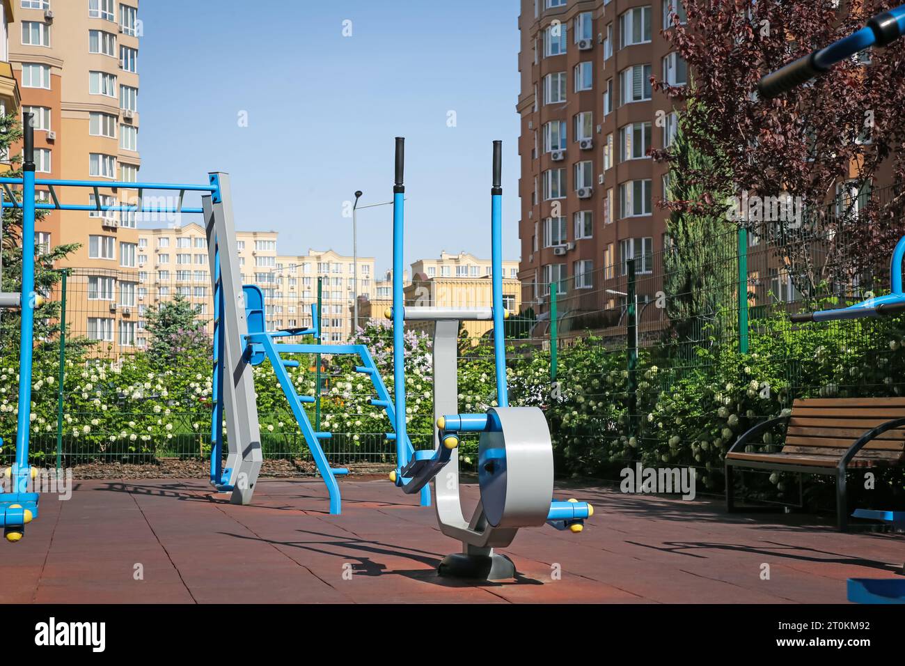 Empty outdoor gym with air walker and monkey bars in residential area Stock Photo