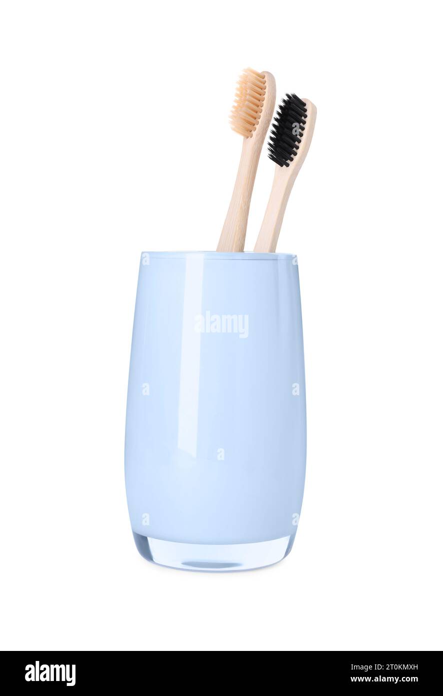 Bamboo toothbrushes in holder isolated on white Stock Photo - Alamy