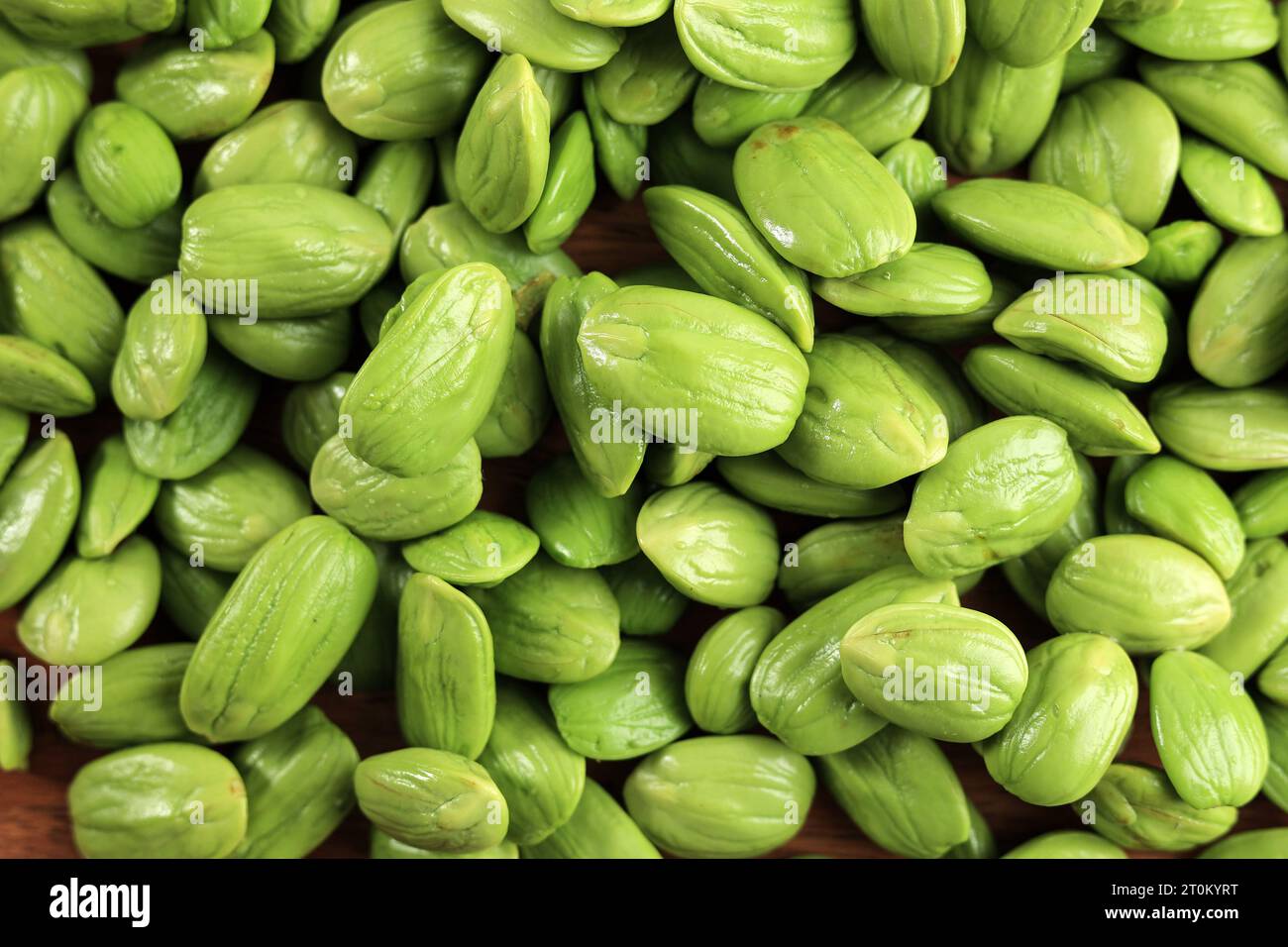 Sato Seeds Parkia speciosa, Pete, or Twisted Cluster Bean. Petai Peeled Stinky Bean Food Background Stock Photo