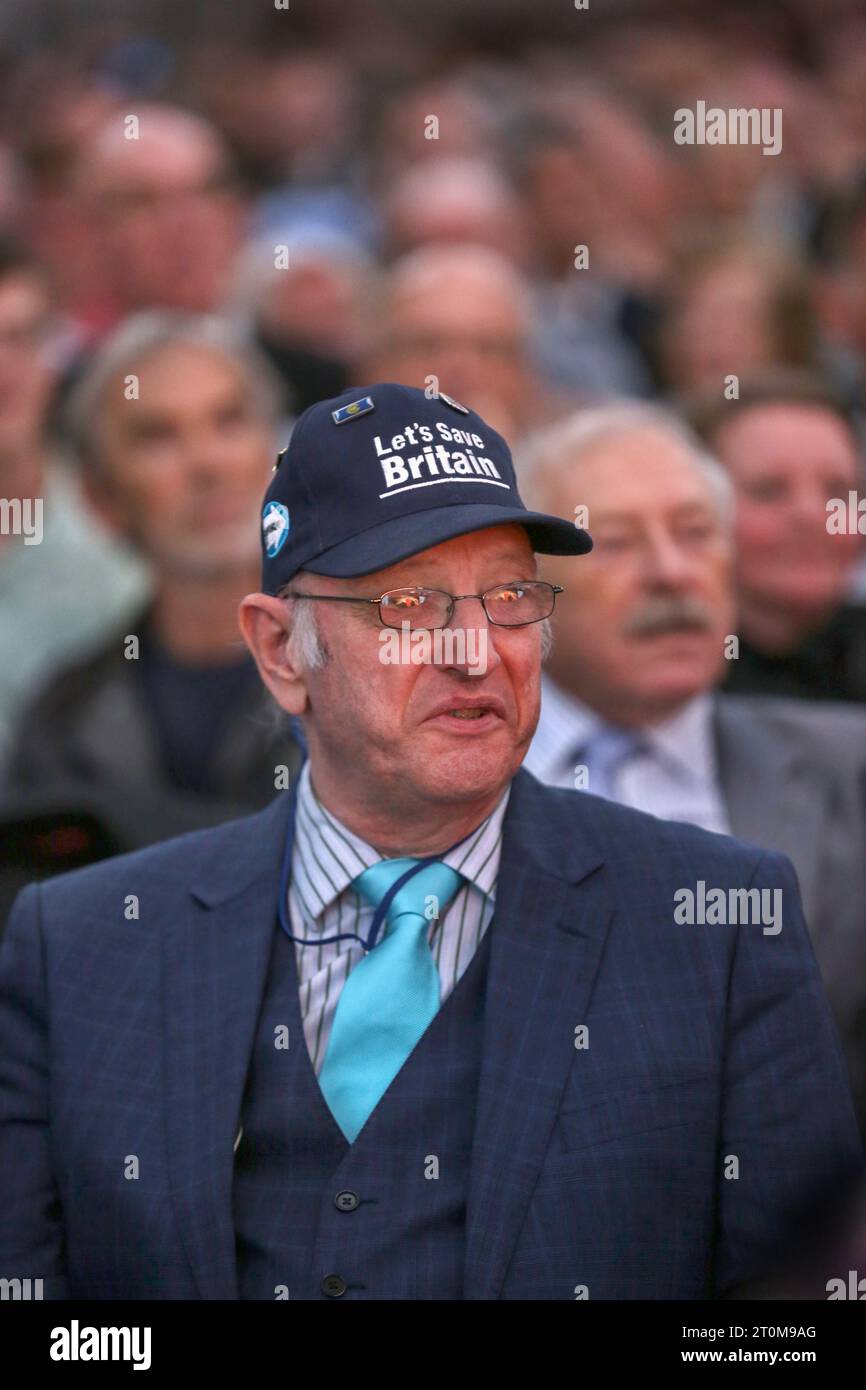 London, UK. 07th Oct, 2023. A delegate wearing a 'Let's Save Britain ...