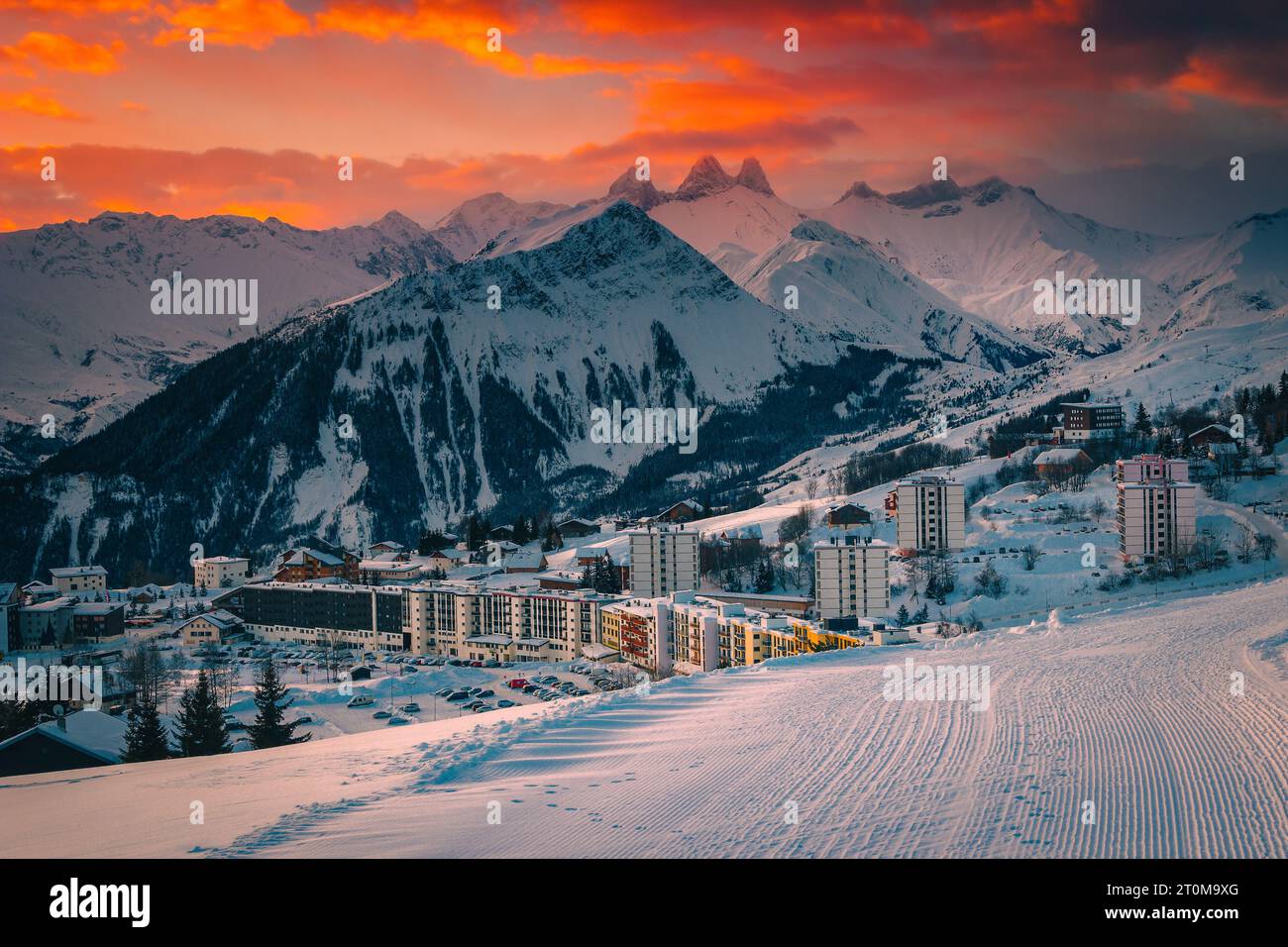 Majestic winter mountain resort with modern buildings at sunrise, La Toussuire, France, Europe Stock Photo