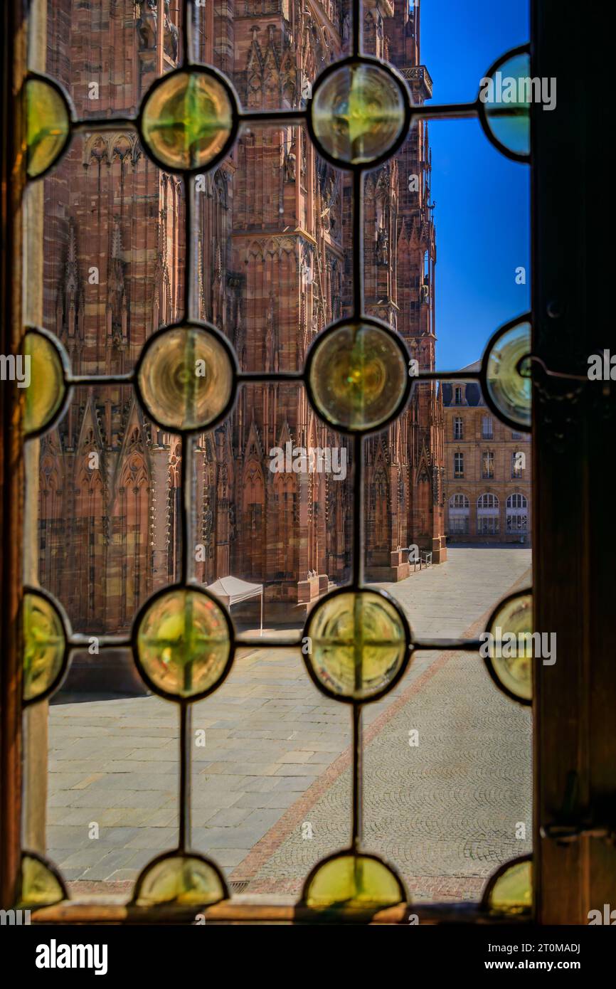 Ornate Gothic facade of the Notre Dame Cathedral seen through bottle