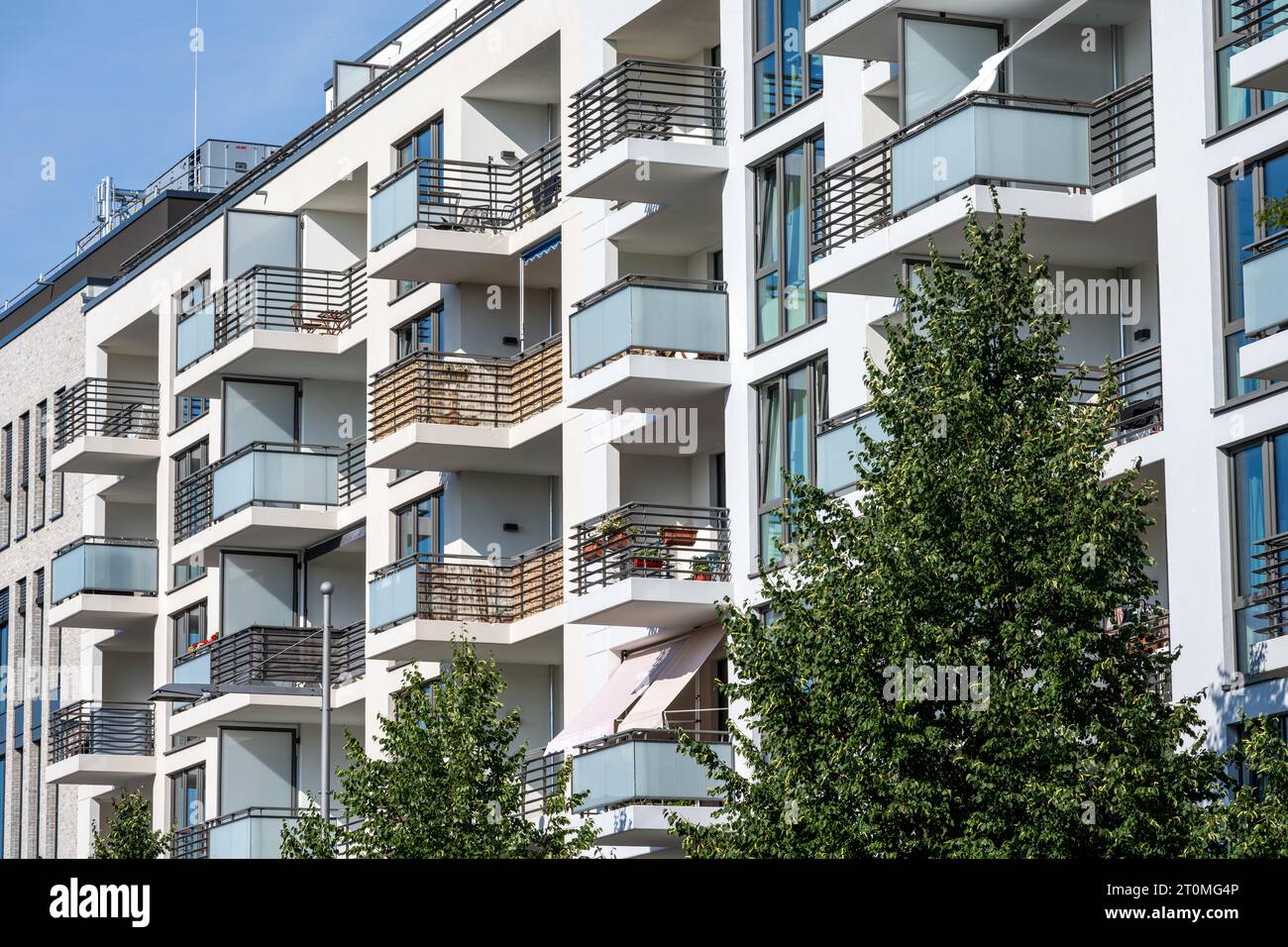 Apartment building with green trees seen in Berlin, Germany Stock Photo