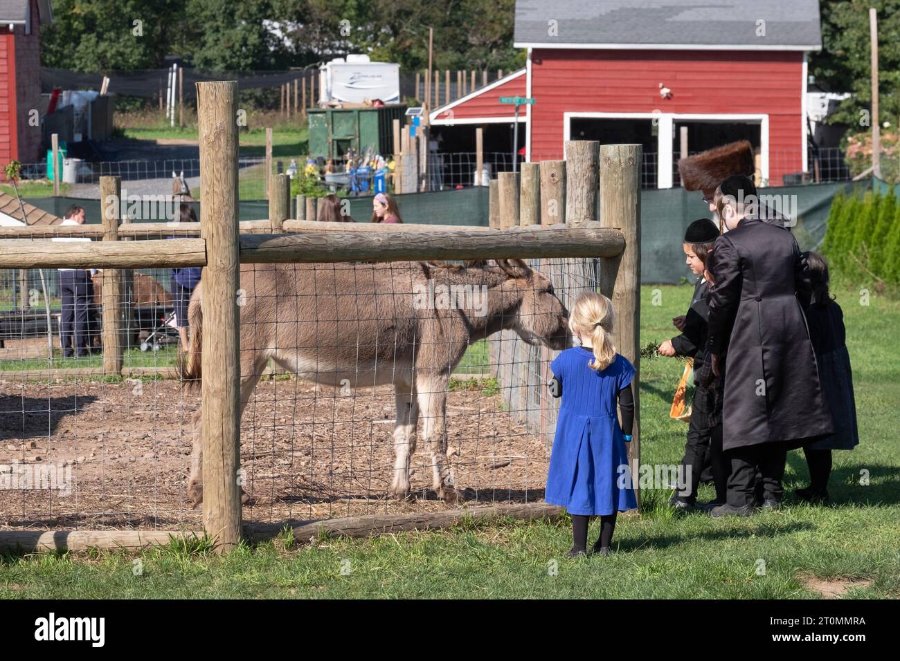 An orthodox Jewish family celebrates Sukkos by visiting the West Maple