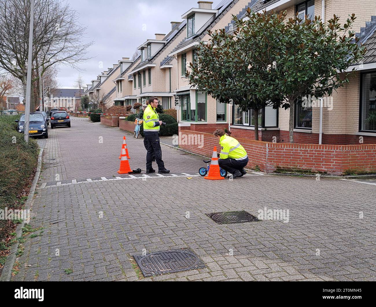 Forensic investigators working on investigation in collision between child and car in the Netherlands Stock Photo