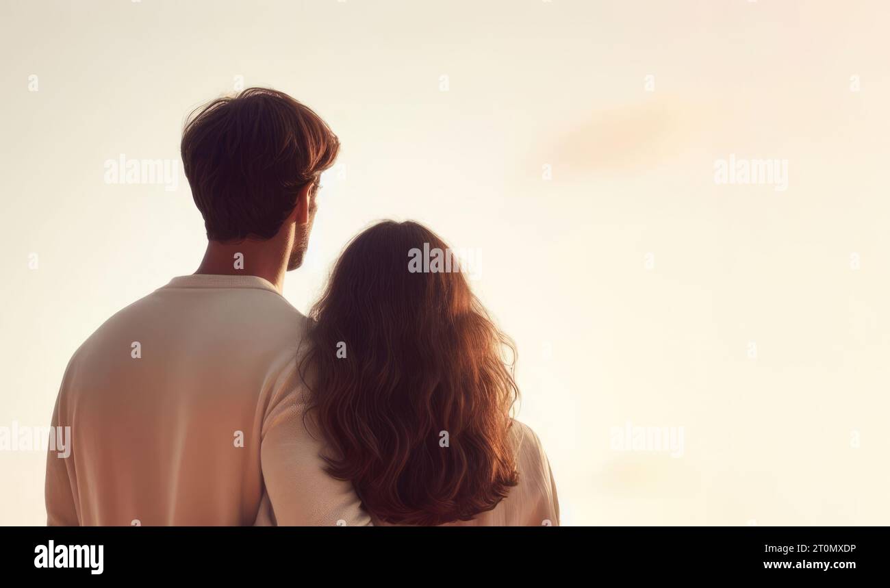 Back view of a mid 30s couple looking at the future together. DINK or Double Income No Kids concept Stock Photo