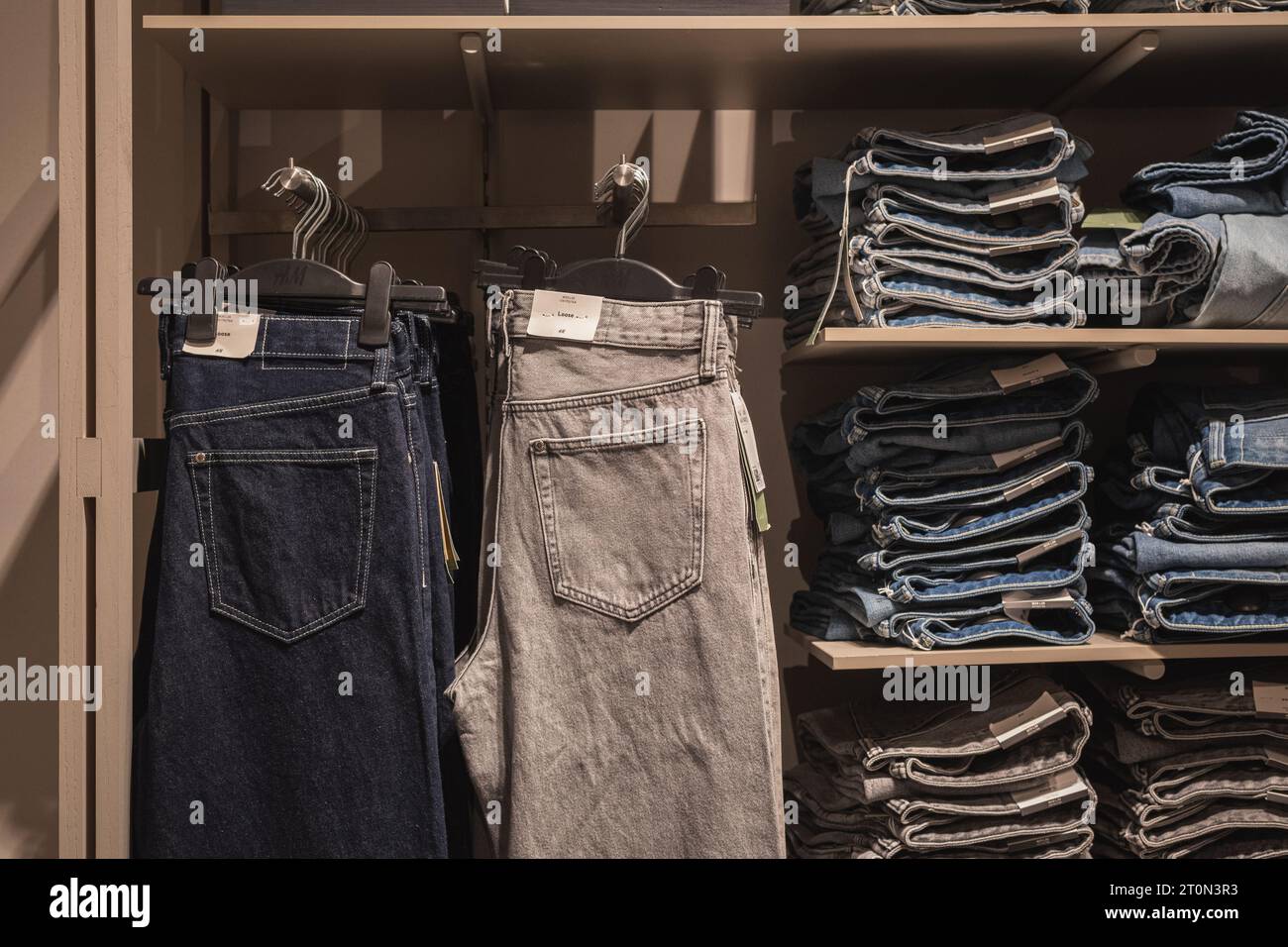 Bangkok, Thailand - September 16, 2023: jeans in H&M store. Stock Photo