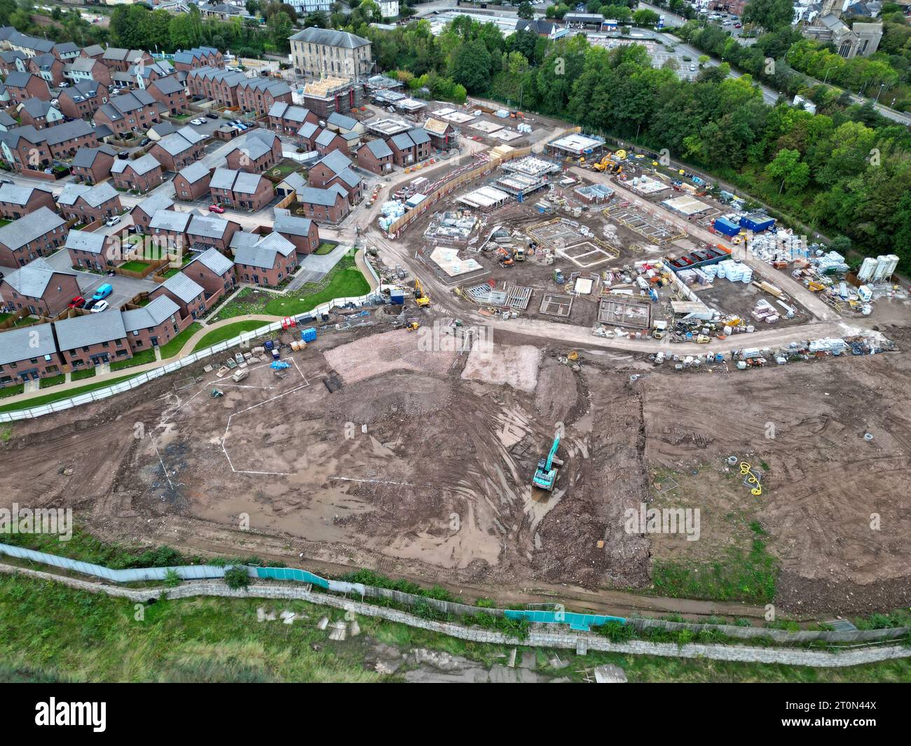 Aerial drone view of new housing under construction alongside newly
