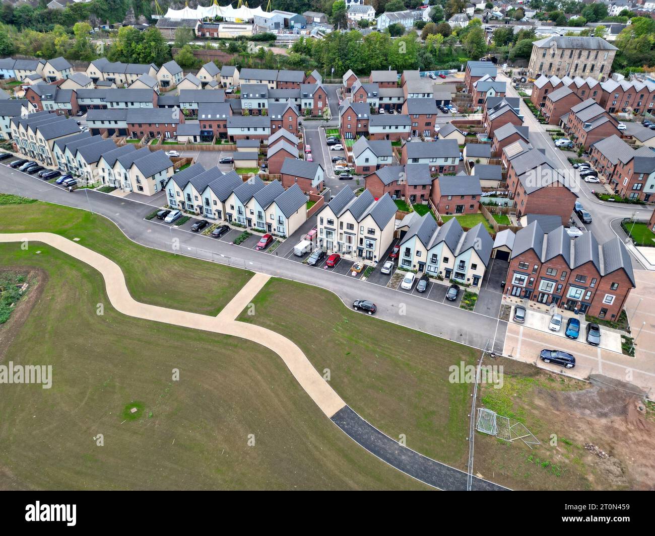 Aerial drone view of new housing under construction alongside newly