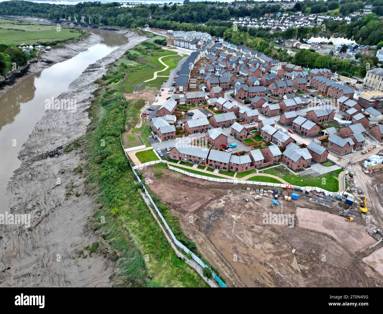 Aerial drone view of new housing under construction alongside newly