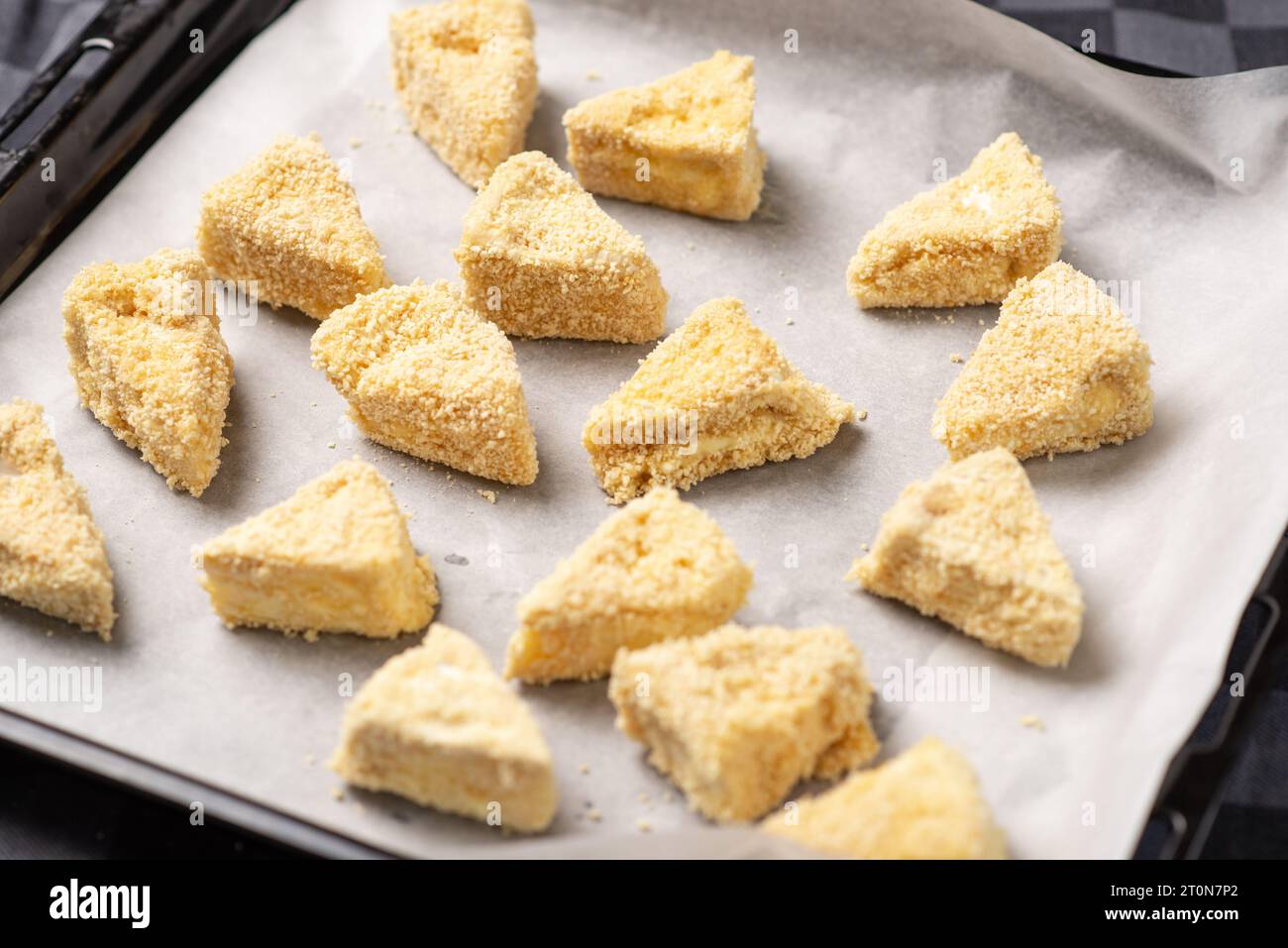 Recipe for fried camembert cheese. Triangular slices of cheese in