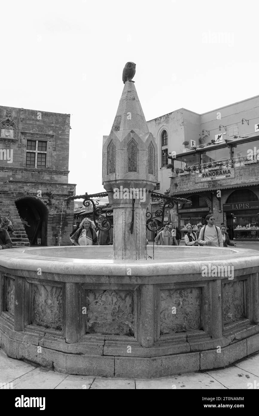 Black and white Castellania fountain (Socratous fountain) located at the prime location of Ippokratous square in Rhodes, Old Town Stock Photo