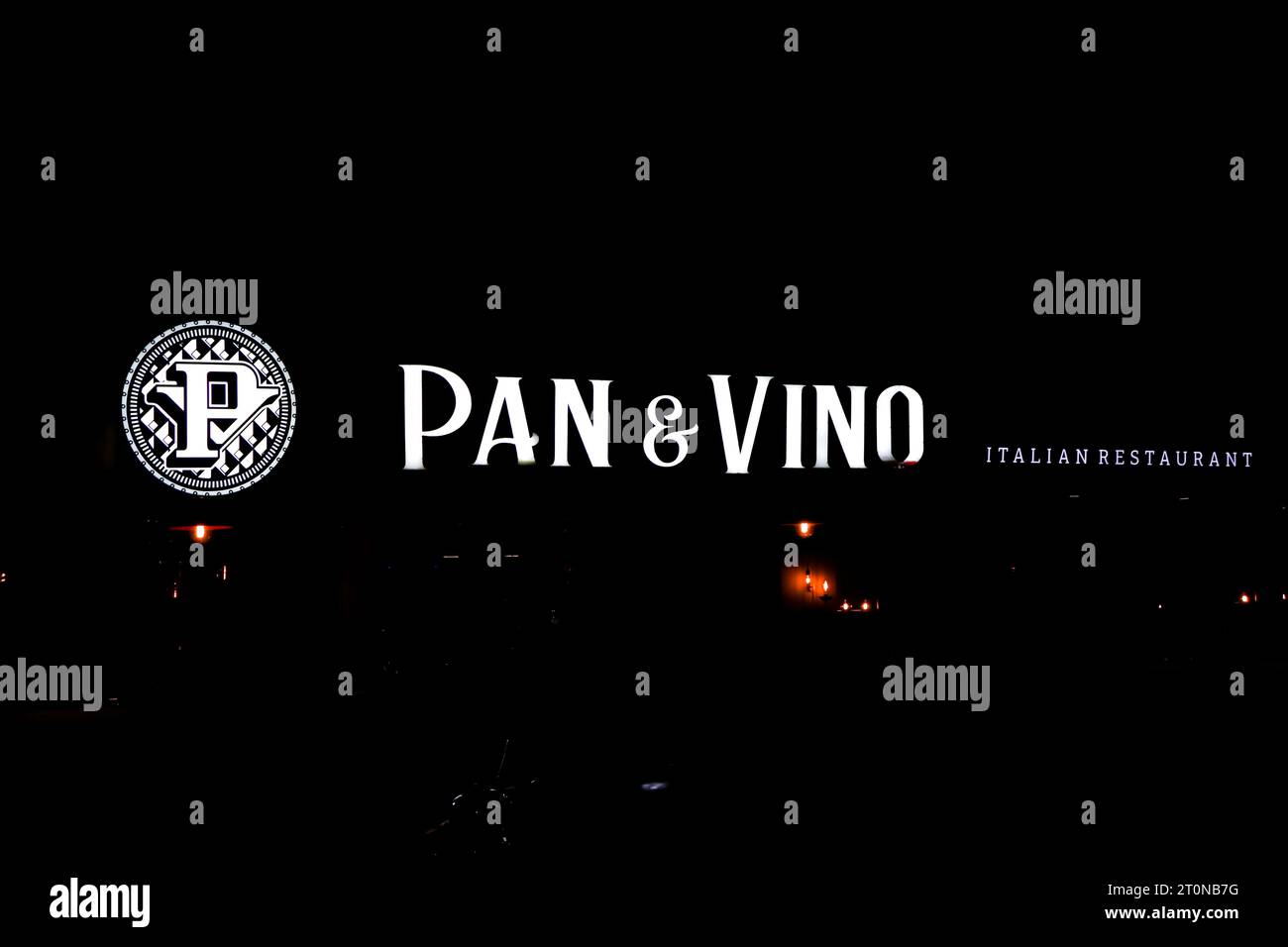 Pan and Vino Italian Restaurant front sign lit during the night Stock Photo