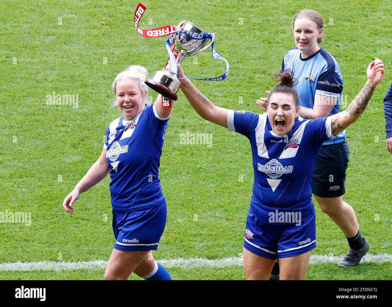 Barrow Raiders' Jodie Litherland (left) and Demi Fisher celebrate with the trophy after winning the Betfred Women's Super League promotion final match at the LNER Community Stadium, York. Picture date: Sunday October 8, 2023. Stock Photo