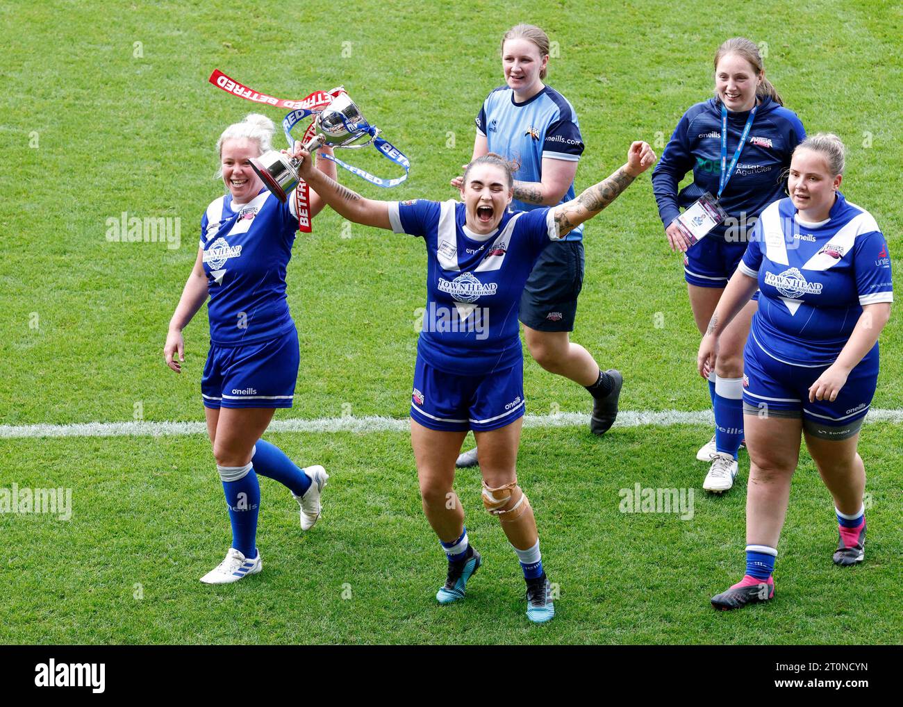 Barrow Raiders' Jodie Litherland (left) and Demi Fisher celebrate with the trophy after winning the Betfred Women's Super League promotion final match at the LNER Community Stadium, York. Picture date: Sunday October 8, 2023. Stock Photo