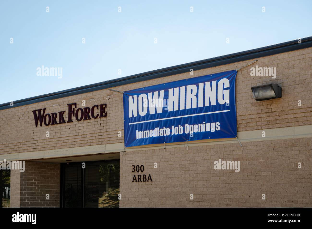 Now hiring, immediate job openings sign hanging at a WorkForce employment office in Montgomery Alabama, USA. Stock Photo