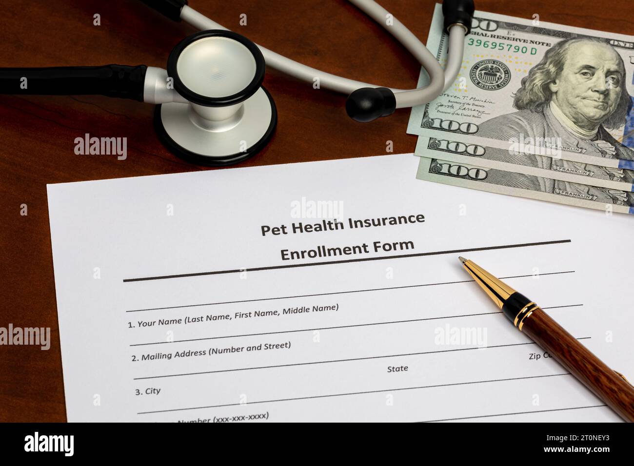 Pet health insurance form with stethoscope and cash money. Pet care, veterinarian and medical expenses. Stock Photo