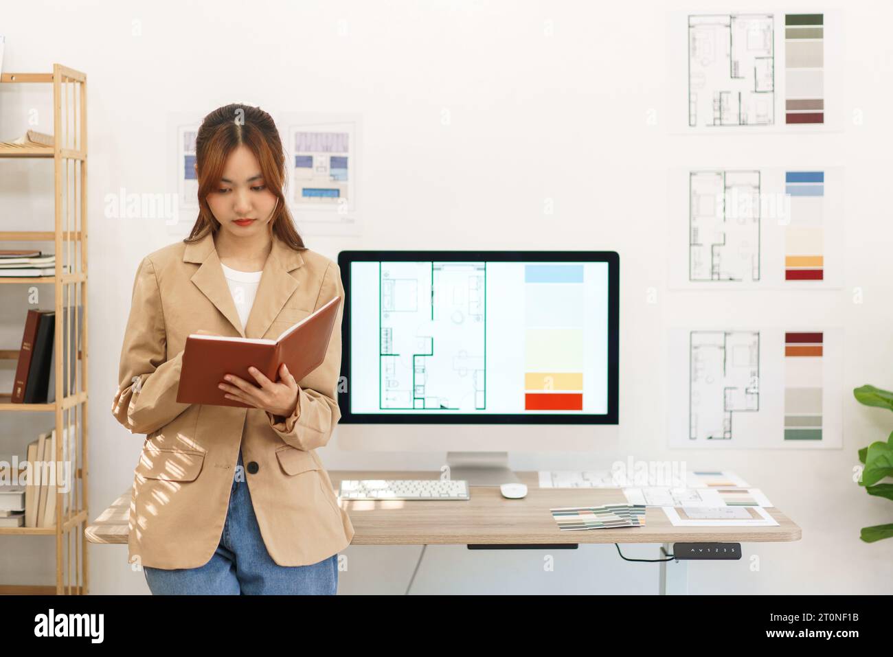 Architectural concept, Female architect write planning data of ...