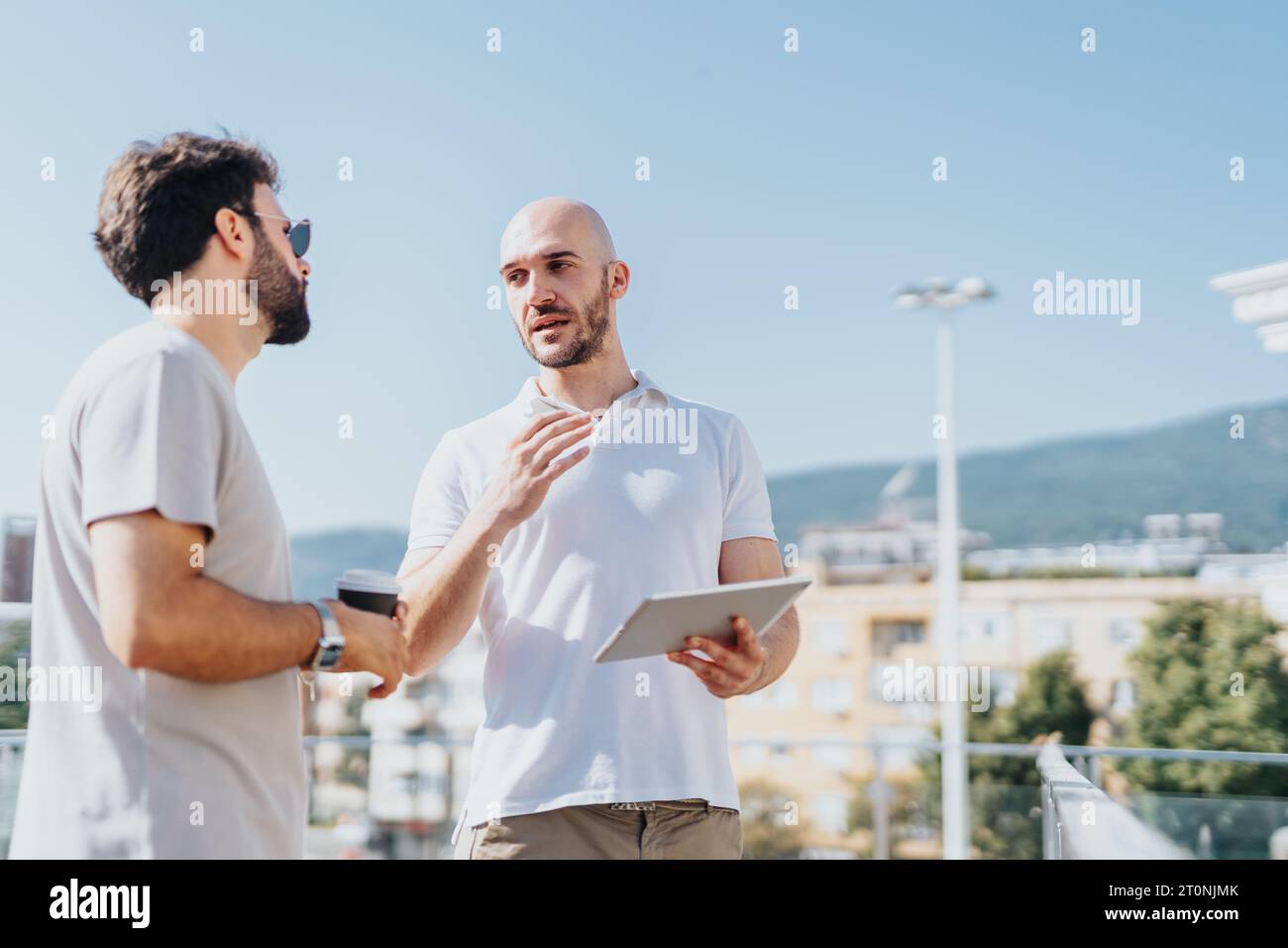 Successful Architects Collaborating on Urban Construction Project Stock Photo