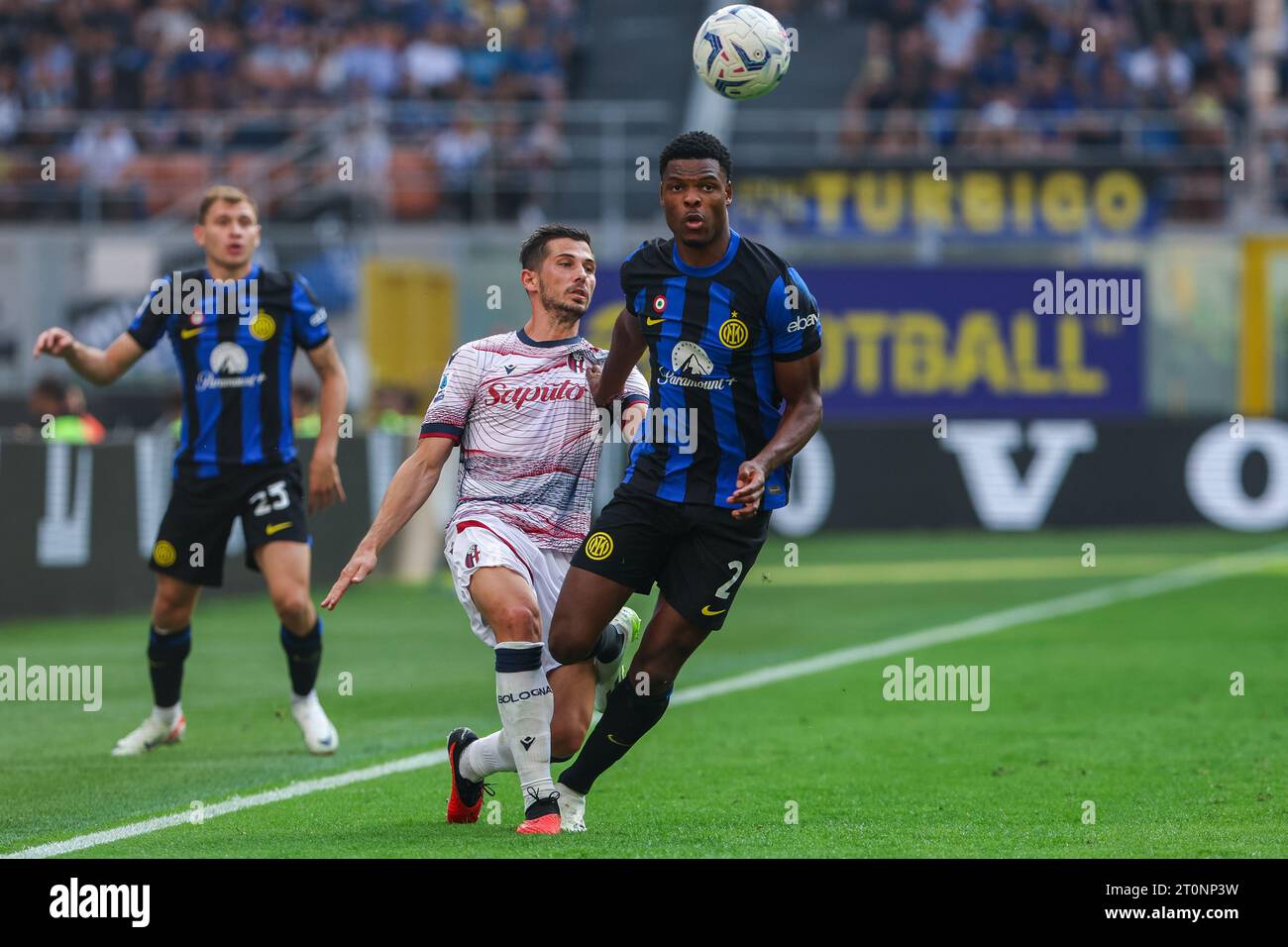 Denzel Dumfries of FC Internazionale (R) and Remo Freuler of Bologna FC (L) in action during the Serie A 2023/24 football match between FC Internazionale and Bologna FC at Giuseppe Meazza Stadium. Final score Inter  2:2  Bologna. Stock Photo