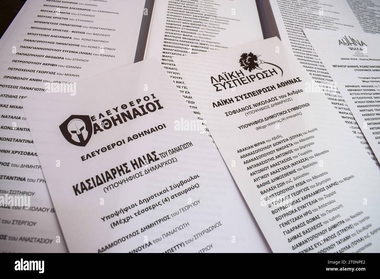 Athens, Greece. 08 October 2023. An ancient Spartan helmet and the name of Ilias Kasidiaris are printed on the ballots (L) for the local elections at a polling station. Despite being jailed, the former far right Golden Dawn deputy leader Ilias Kasidiaris runs for the mayorship of the Greek capital. Citizens vote to elect representatives in 13 regions and hundreds of municipalities throughout the country. Credit: Dimitris Aspiotis/Alamy Live News Stock Photo