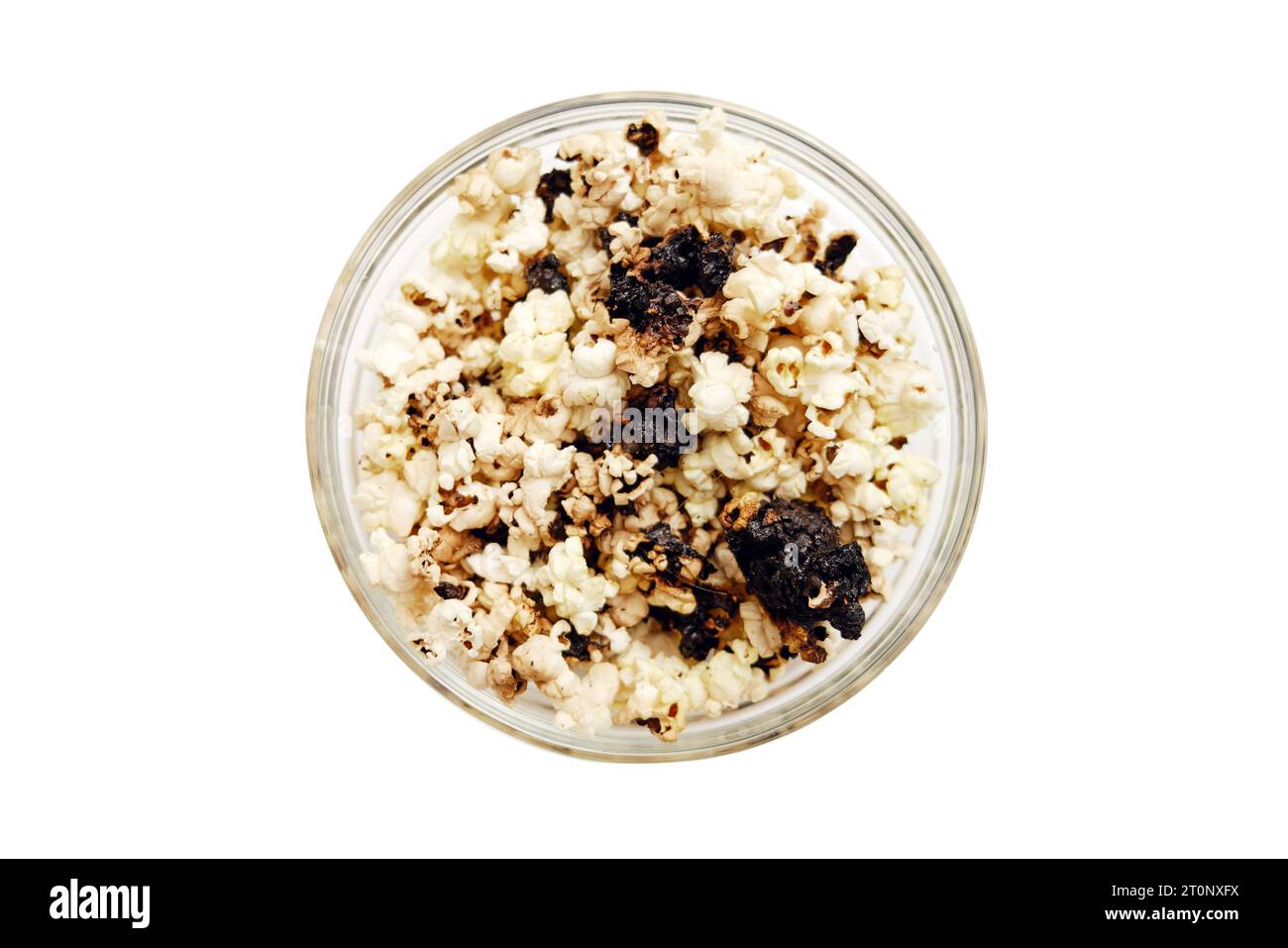 Burnt popcorn from a home microwave. Burn corn kernels on the kitchen