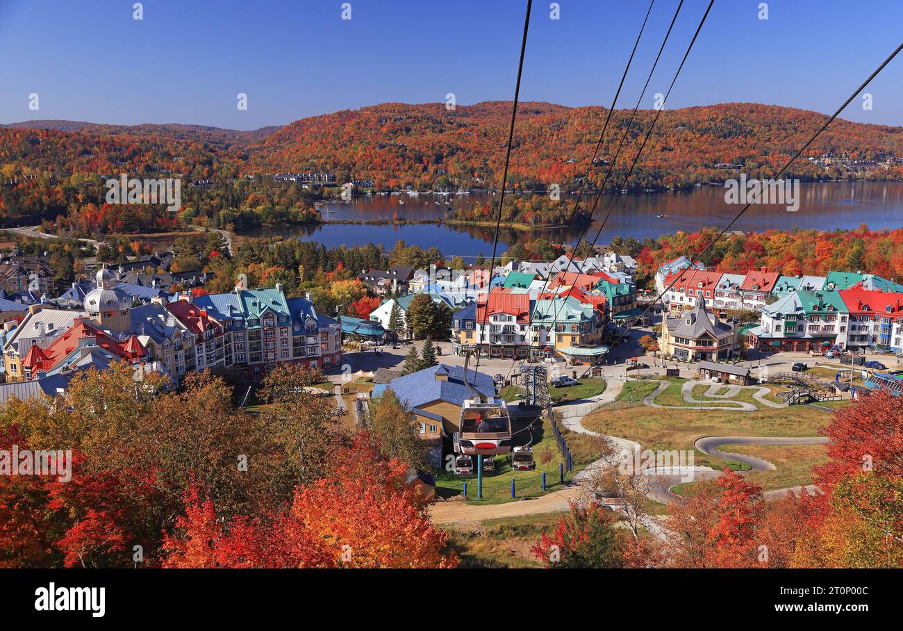 Lake and Mont Tremblant resort in autumn with cable car on the foreground, Canada Stock Photo