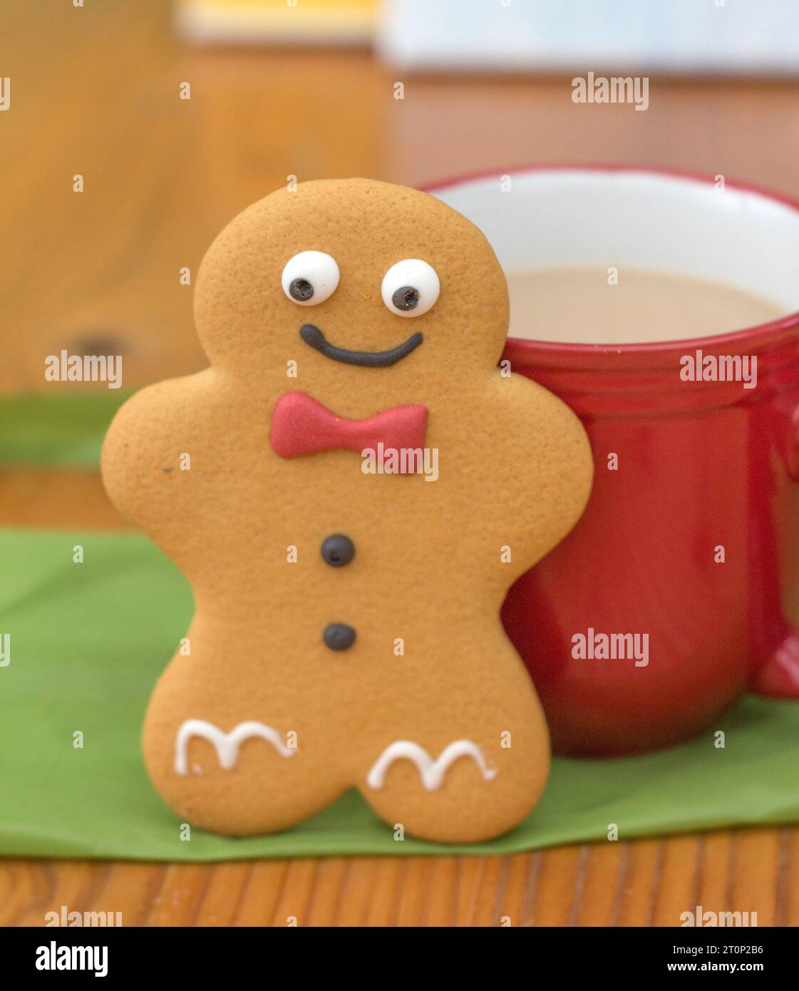 A Gingerbread Man and mug of tea at teabreak Stock Photo