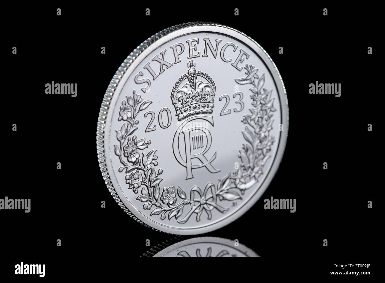 The 2023 Silver Sixpence is the first Sixpence to feature KIng Charles III and has the Kings cypher on the reverse side of the coin Stock Photo