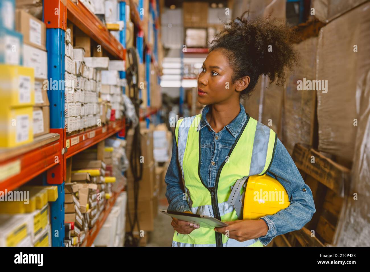 Woman teen worker African American black girl employee working in stock