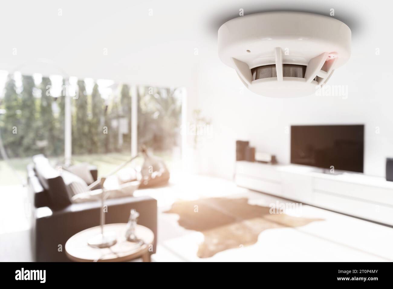 smoke detector fire alarm detector home safety device setup at home apartment room ceiling Stock Photo