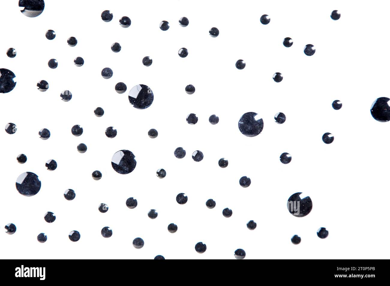 Googly eyes are small plastic craft supplies used to imitate eyeballs  isolated on black background., Stock image
