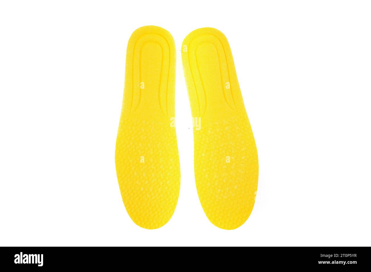 Yellow foam padded shoe inserts side by side Stock Photo Alamy