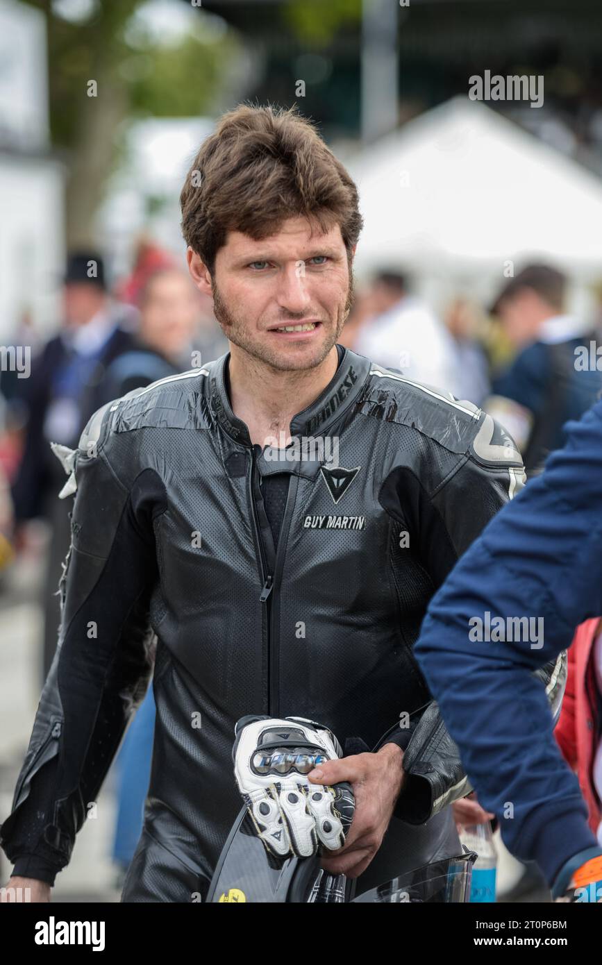 Guy Martin - motorcycle racer and tv celebrity - at the Goodwood Revival 2017 in black motorcycle riding leathers Stock Photo
