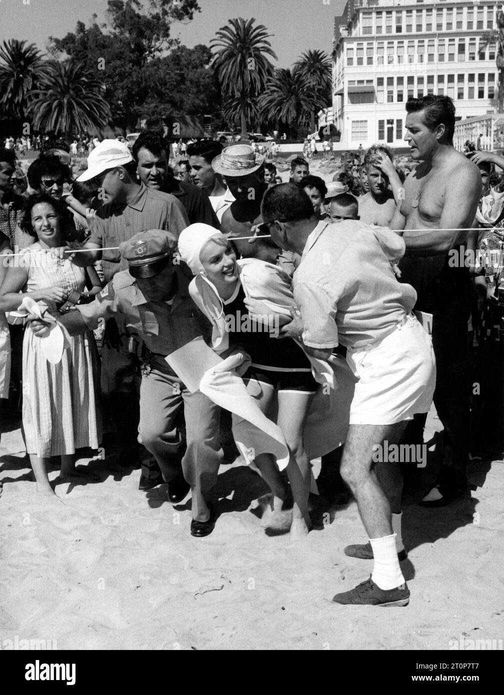 MARILYN MONROE welcomed by Director BILLY WILDER on set location candid on Coronado Beach, California during filming of SOME LIKE IT HOT 1959 director BILLY WILDER screenplay Billy Wilder and I.A.L. Diamond Ashton Productions / The Mirisch Corporation / United Artists Stock Photo