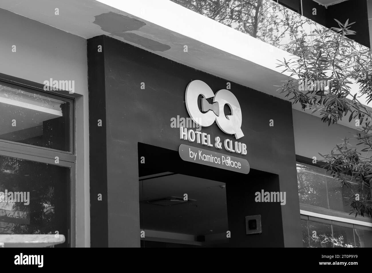 Hotel and Club, an adults only Rhodes city lodging accommodation front entrance in black and white Stock Photo