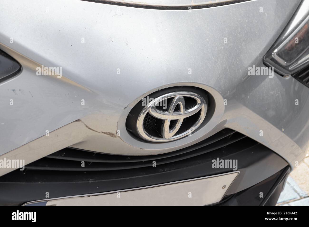 TOYOTA logo on front hood of silver car Stock Photo
