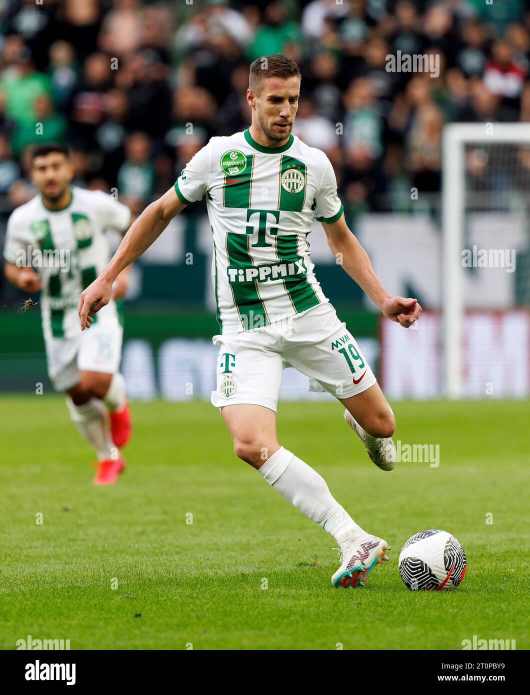 Budapest, Hungary. 31st August, 2023. Barnabas Varga of Ferencvarosi TC  competes for the ball with Nassim Hnid of FK Zalgiris Vilnius during the  UEFA Europa Conference League Play Off Round Second Leg