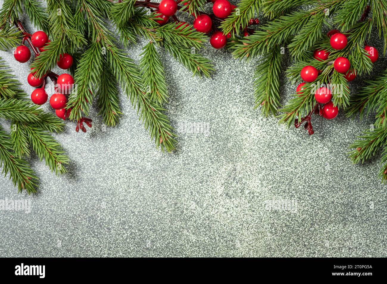 Christmas background with fir branches on the old white wooden board ...